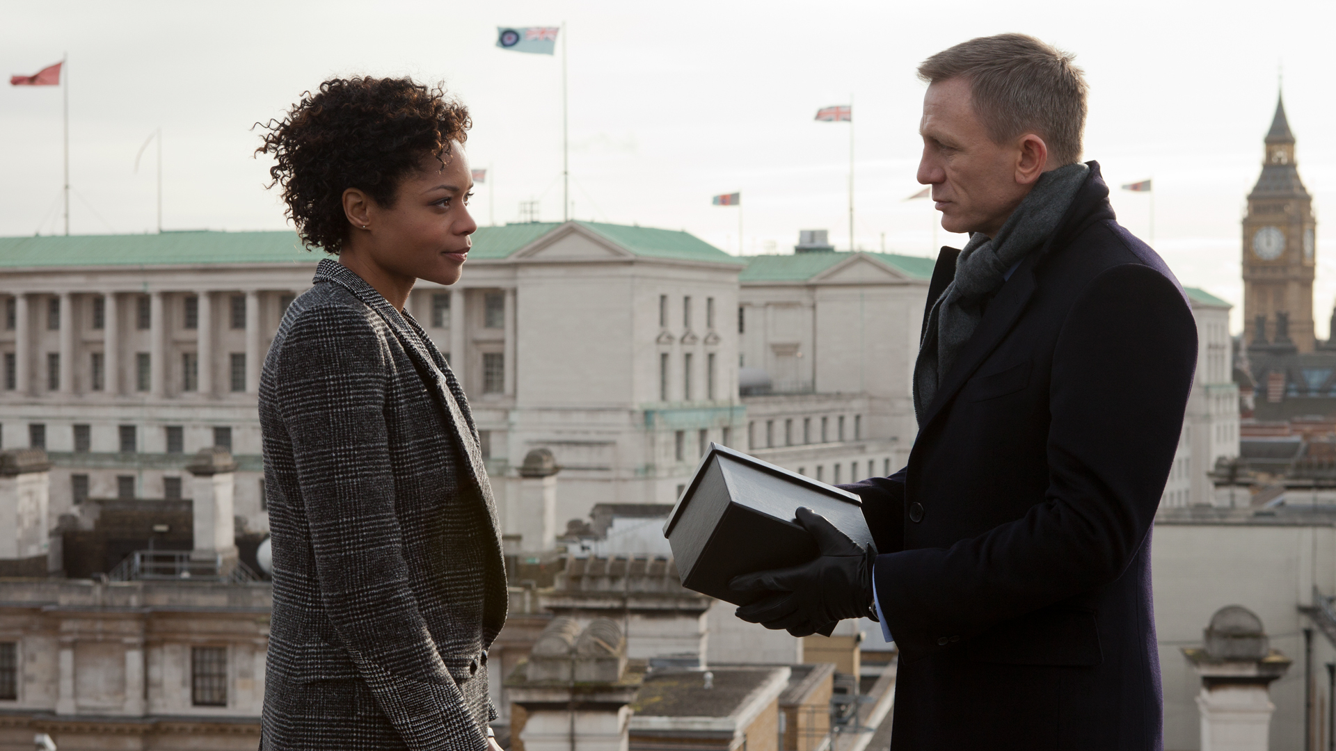 Eve (Naomie Harris) presents Bond (Daniel Craig) with a ceramic gift from M in "Skyfall."