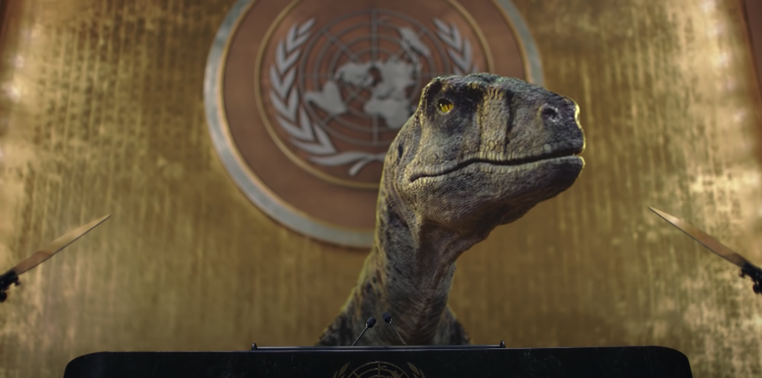 Dinosaurio CGI habla en el podio en un video de la ONU